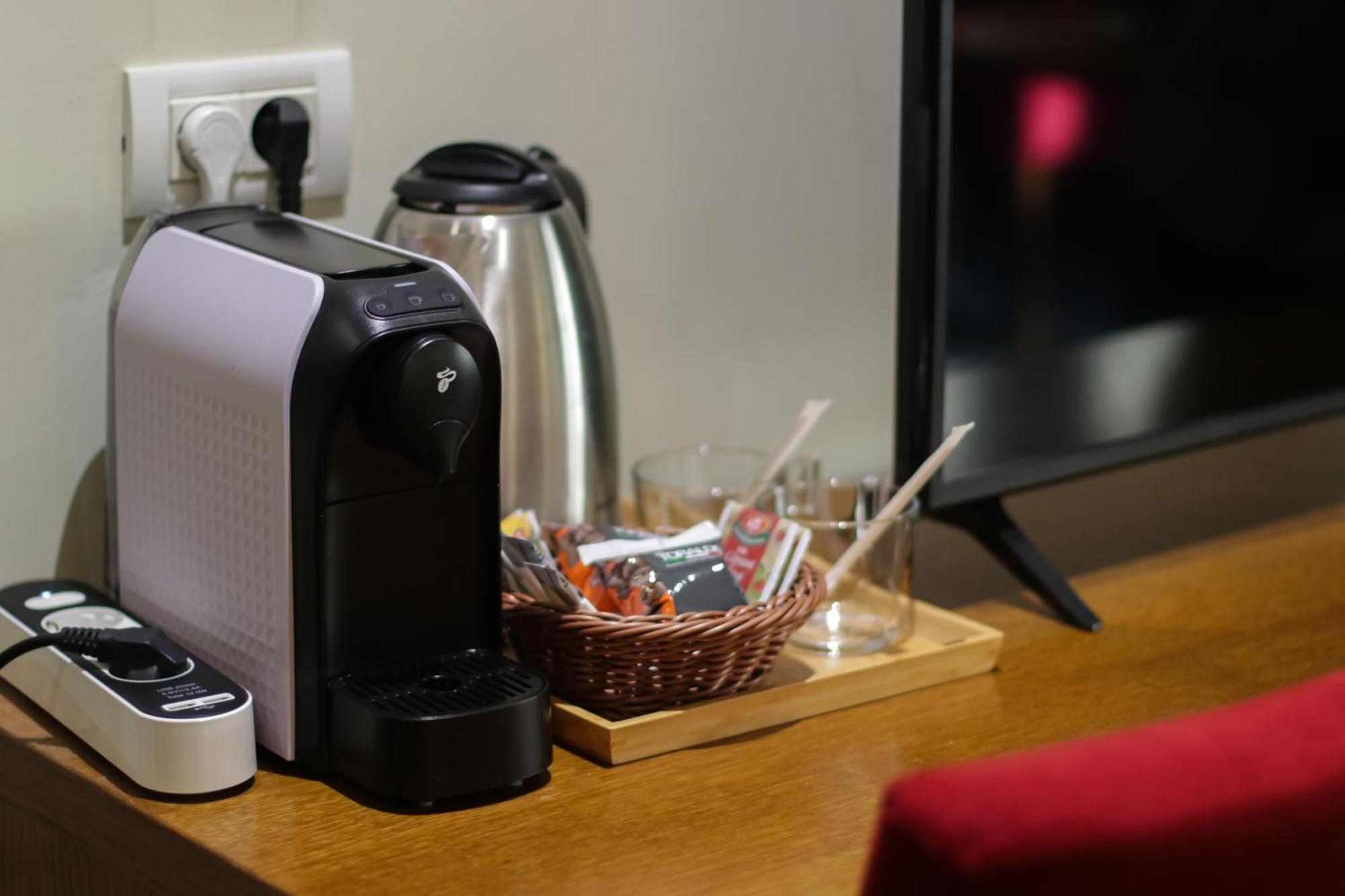 Opus Villa Sinaia Dış mekan fotoğraf A Nespresso coffee machine in a hotel room